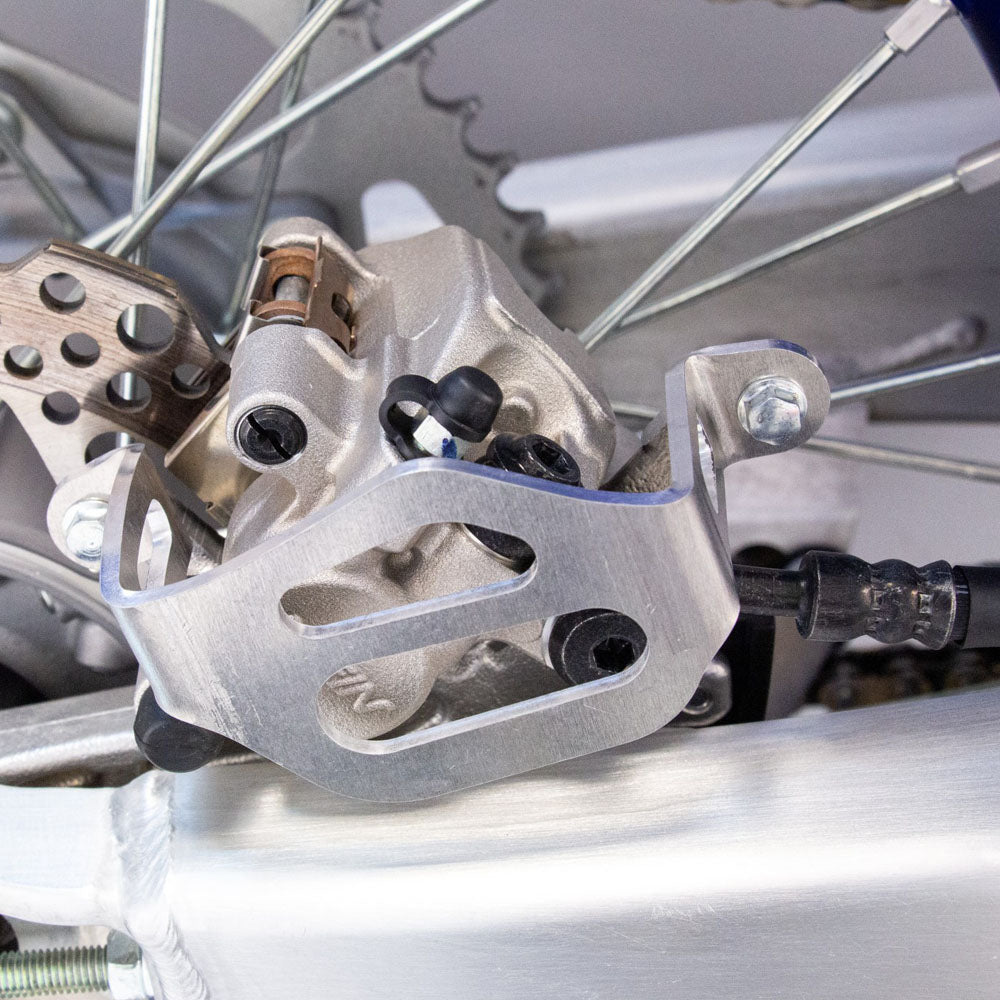 Works Connection REAR BRAKE CALIPER GUARD YAMAHA YZ125/250 22-25, YZ12/250X 23-25, YZ250F 21-25, YZ250FX 22-25, YZ450F 20-25, YZ450FX 21-25   